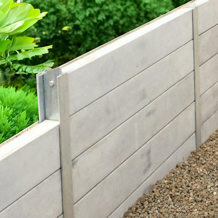 Concrete sleeper retaining wall built between galvanised steel posts
