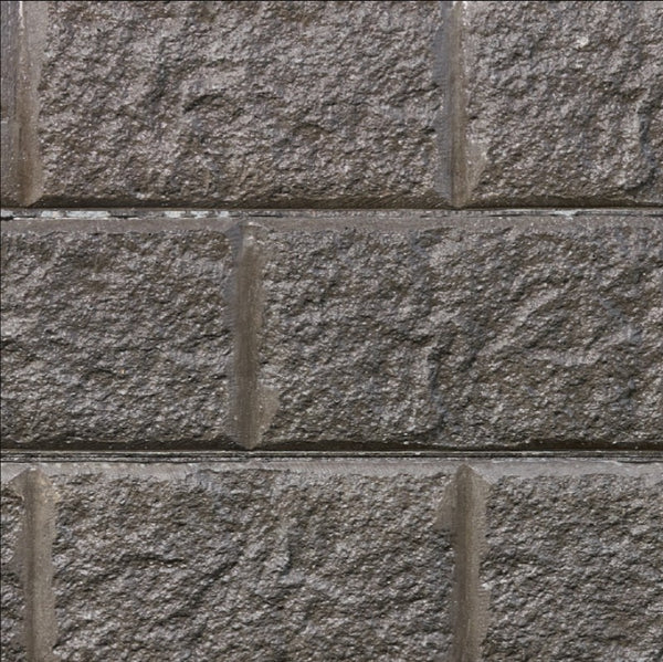Sandstone-look concrete sleeper retaining wall finish suited to a front yard feature wall